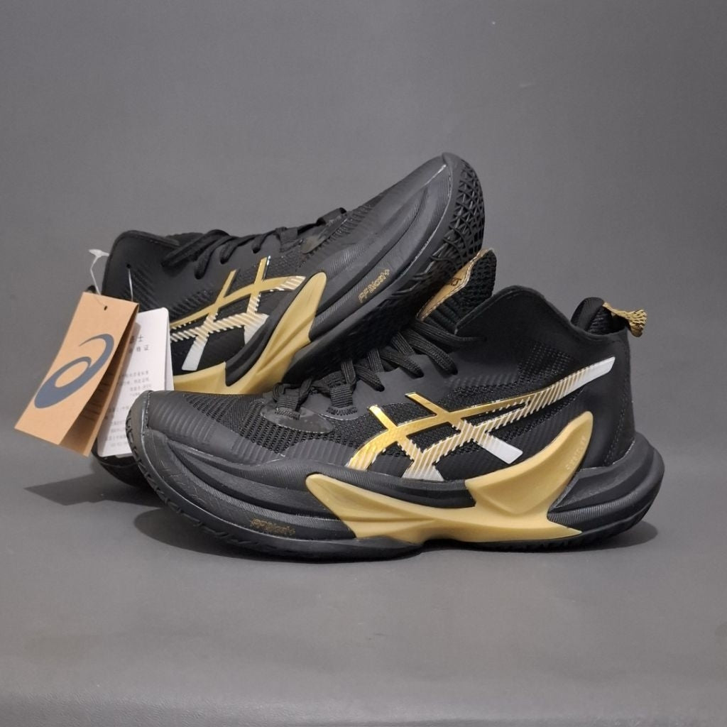 ASICS Metarise 2 volleyball shoes in a black and gold colorway