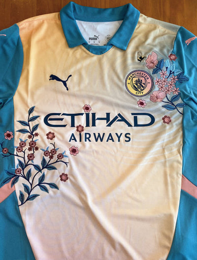 Floral embroidery on the Man City