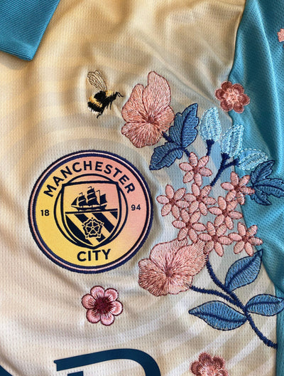 Floral embroidery on the Man City