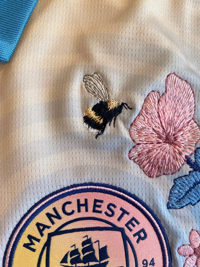 Floral embroidery on the Man City